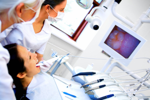 Image of dental checkup being given to a woman